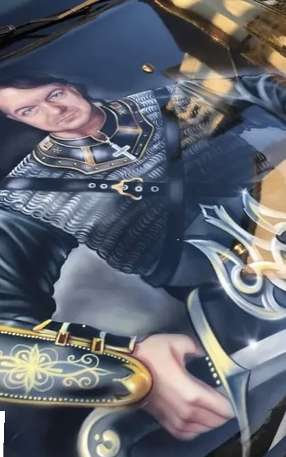 Portrait of a figure in armour airbrushed across a vehicle hood