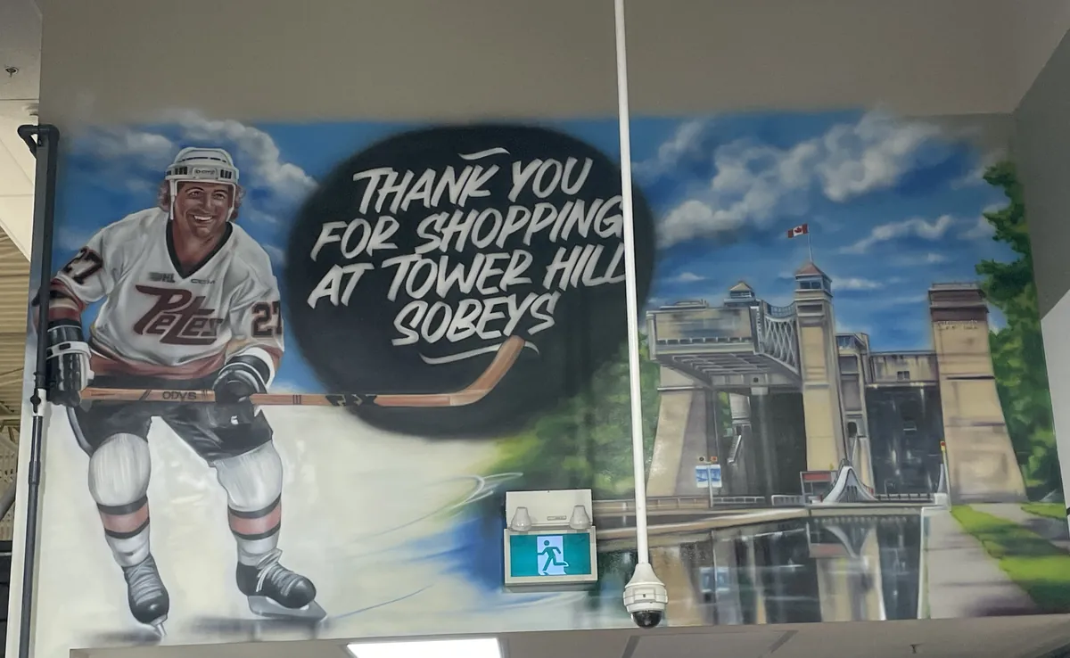 Tower Hill Sobeys mural — hockey player and lift bridge