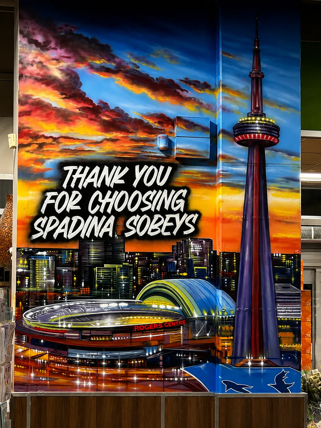 CN Tower night skyline mural at Spadina Sobeys — 'Thank you for choosing Spadina Sobeys'